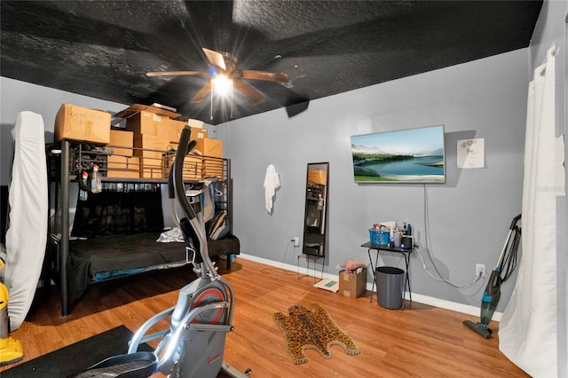 exercise area with wood-type flooring