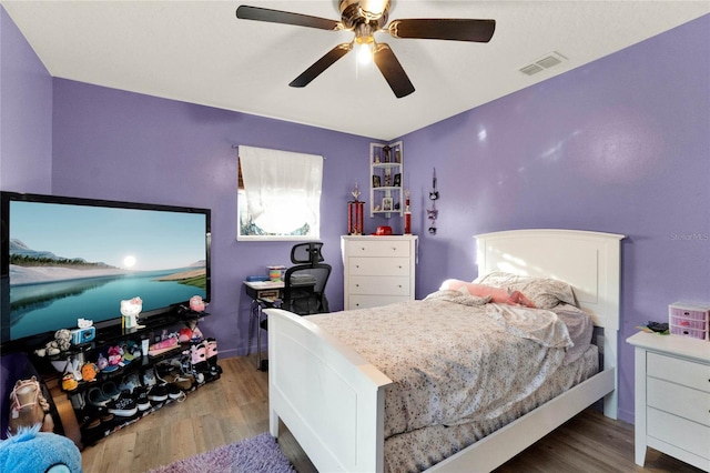 bedroom featuring hardwood / wood-style floors and ceiling fan