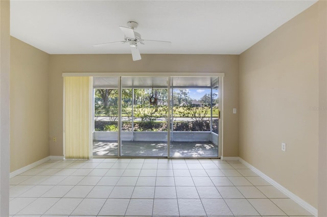 unfurnished room featuring light tile patterned floors and ceiling fan