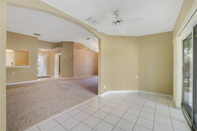 carpeted empty room featuring ceiling fan