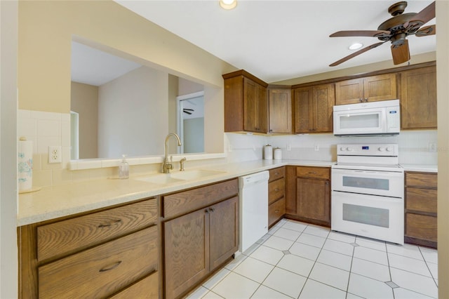 kitchen featuring white appliances, sink, decorative backsplash, ceiling fan, and light tile patterned flooring