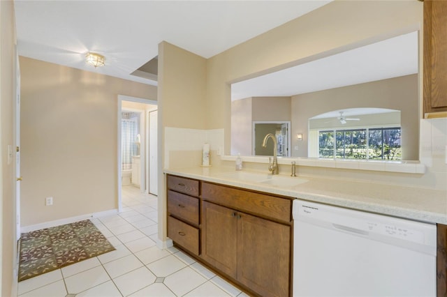 kitchen with ceiling fan, dishwasher, light tile patterned floors, and sink