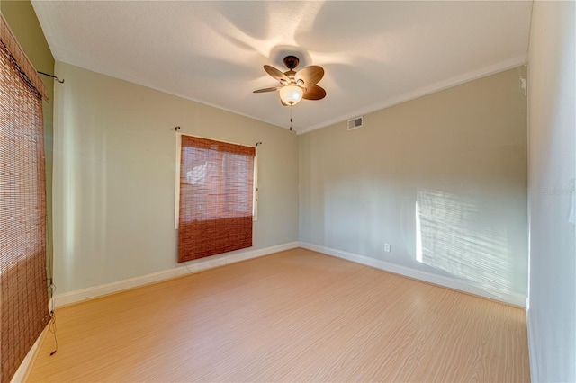 empty room featuring ceiling fan and light wood-type flooring