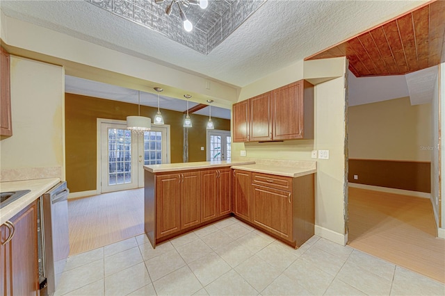 kitchen featuring kitchen peninsula, french doors, a textured ceiling, pendant lighting, and dishwasher