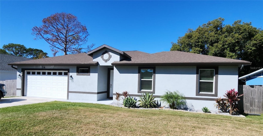 view of front facade featuring a front lawn and a garage