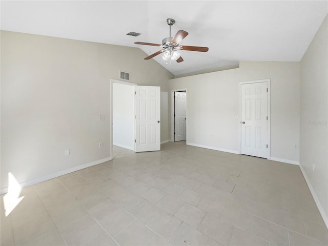 unfurnished bedroom with ceiling fan, light tile patterned flooring, and lofted ceiling