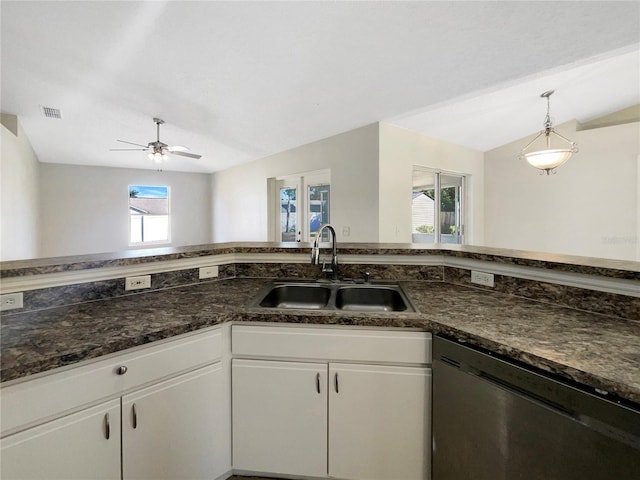 kitchen with stainless steel dishwasher, a healthy amount of sunlight, white cabinetry, and sink