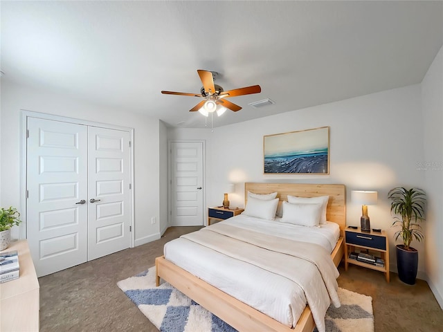 bedroom featuring ceiling fan and dark colored carpet