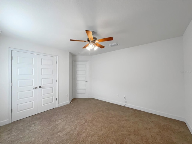 unfurnished bedroom featuring carpet flooring and ceiling fan