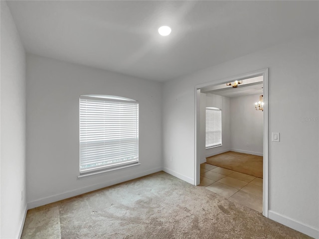 spare room with light carpet