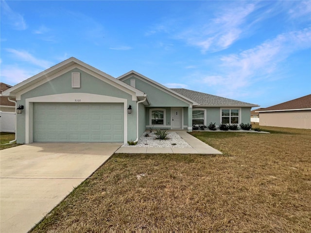 ranch-style house featuring a front yard and a garage