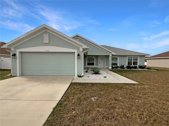 ranch-style home with a front yard and a garage