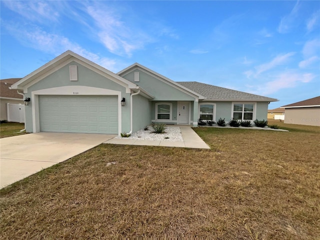 single story home with a garage and a front yard