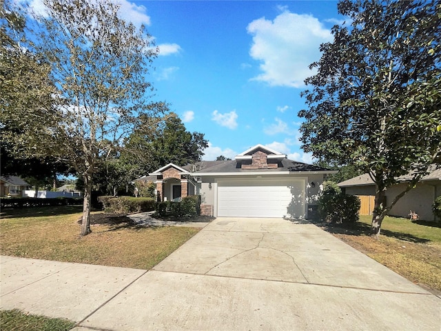 ranch-style home with a garage and a front yard