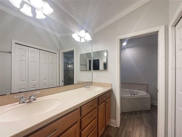 bathroom featuring ornamental molding, vanity, separate shower and tub, hardwood / wood-style flooring, and a notable chandelier