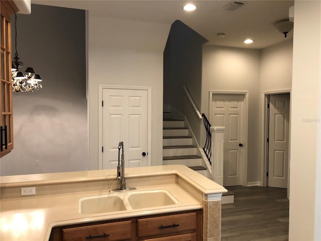 kitchen with sink and dark hardwood / wood-style floors