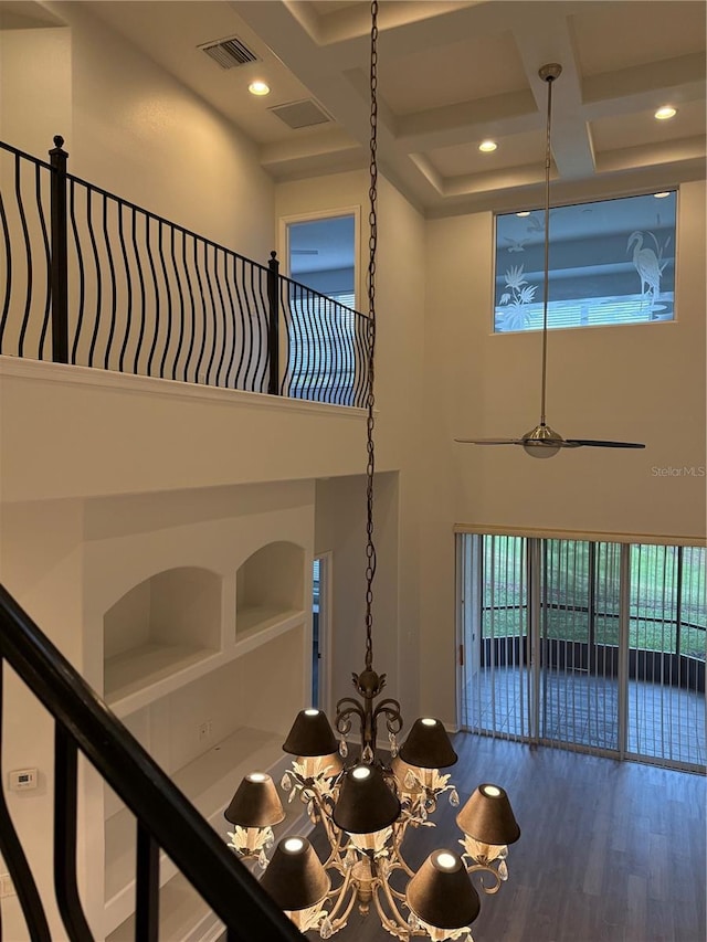 room details with wood-type flooring, coffered ceiling, and beam ceiling