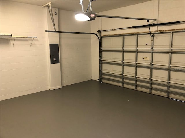 garage featuring a garage door opener and electric panel