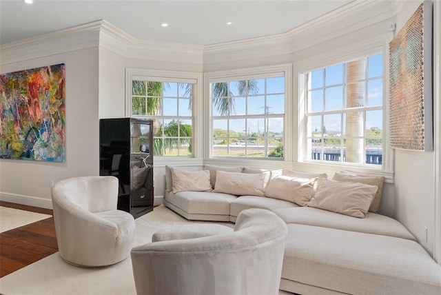 living area with recessed lighting, light wood-style floors, and ornamental molding