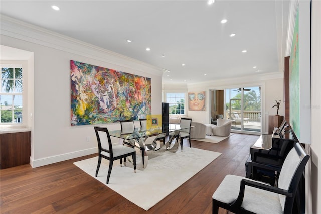 dining space with dark wood finished floors, recessed lighting, baseboards, and ornamental molding