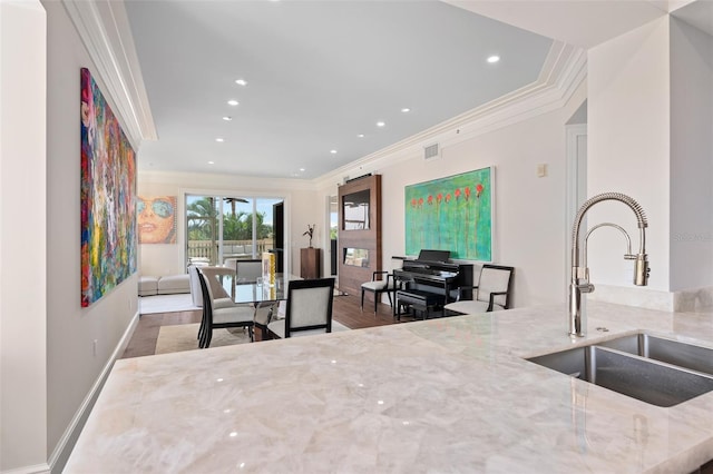 interior space with recessed lighting, crown molding, baseboards, and wood finished floors