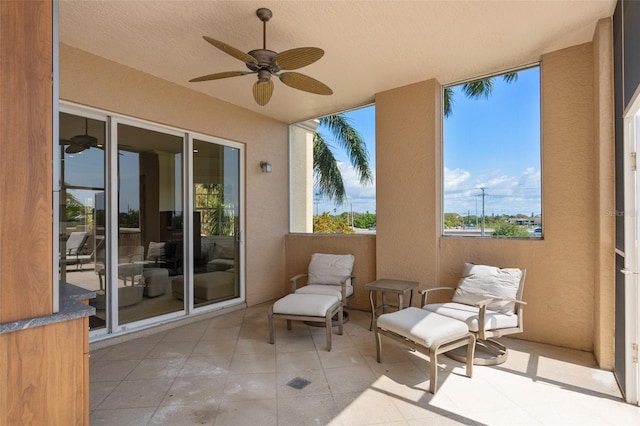 view of patio / terrace featuring a balcony and ceiling fan