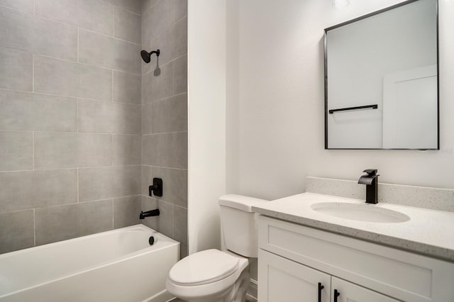 full bathroom with vanity, toilet, and tiled shower / bath