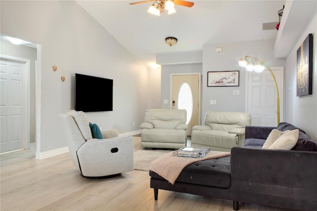 living room featuring ceiling fan, high vaulted ceiling, and light hardwood / wood-style floors