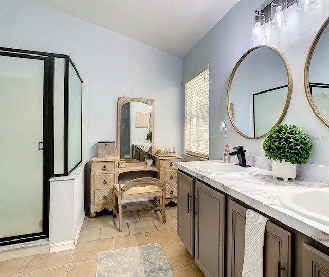 bathroom featuring vanity, tile patterned floors, and a shower with shower door