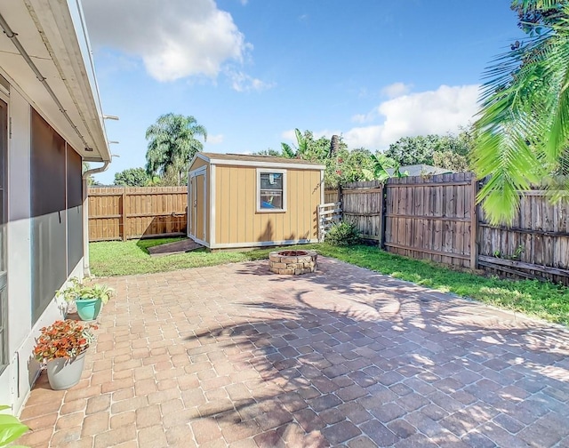 4217 Sky Flower Ln, Saint Cloud, FL 34772 - fenced backyard featuring a fire pit, a patio area, and a shed