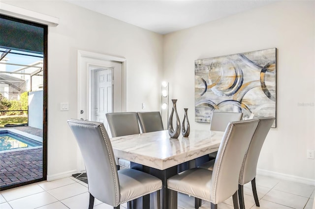 dining area featuring light tile patterned floors