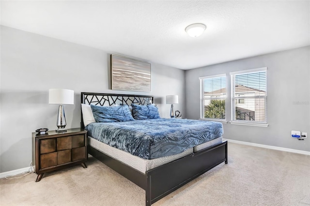 bedroom with light colored carpet