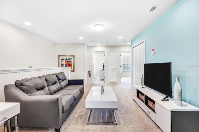 living room featuring light colored carpet