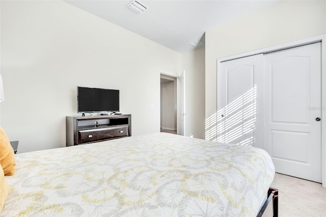 carpeted bedroom featuring a closet