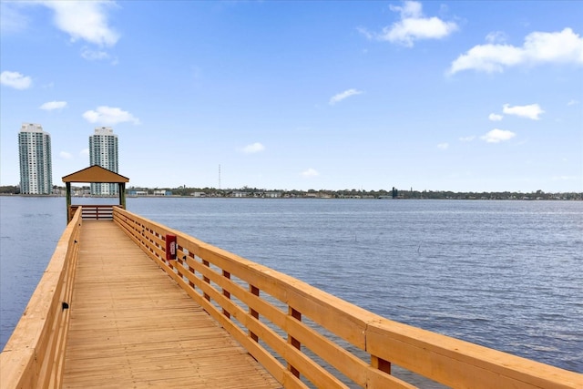 dock area with a gazebo and a water view