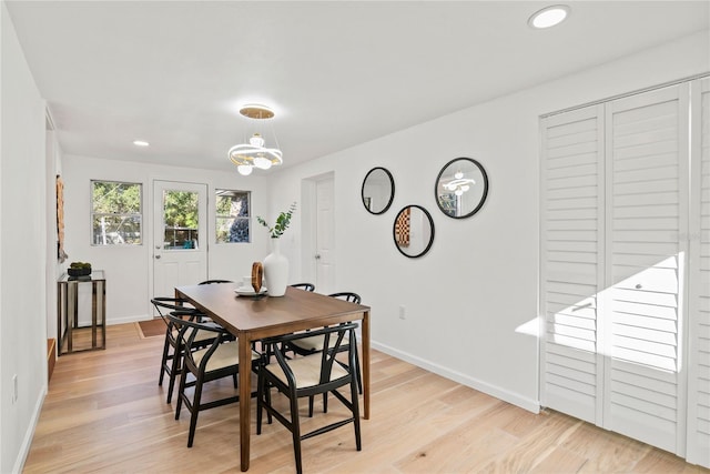 dining area with light hardwood / wood-style floors