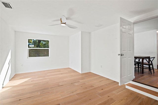 unfurnished room with ceiling fan and light hardwood / wood-style floors