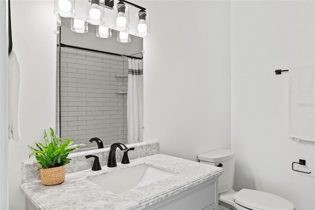 bathroom featuring vanity, a shower with curtain, and toilet