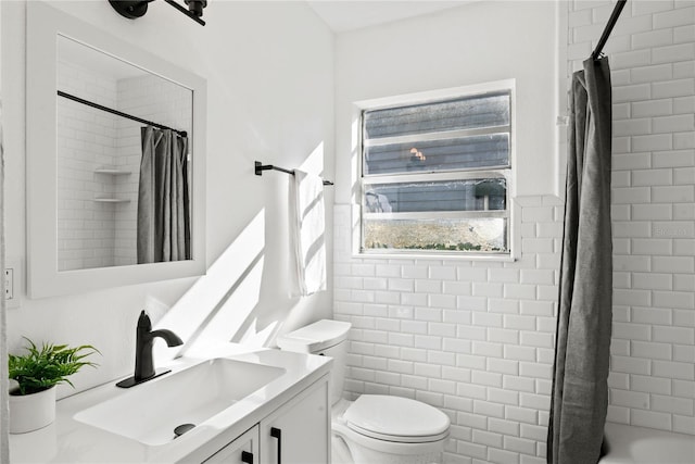 full bathroom featuring vanity, toilet, and shower / tub combo