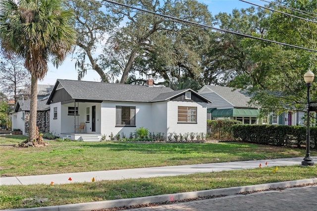 view of front of home with a front lawn