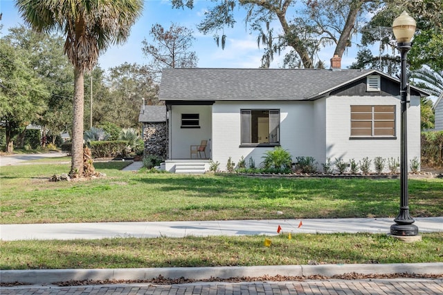 view of front of home with a front lawn