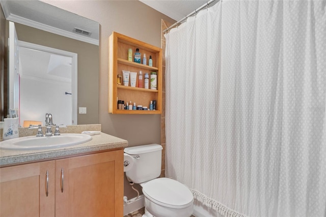 bathroom featuring a textured ceiling, vanity, toilet, and crown molding