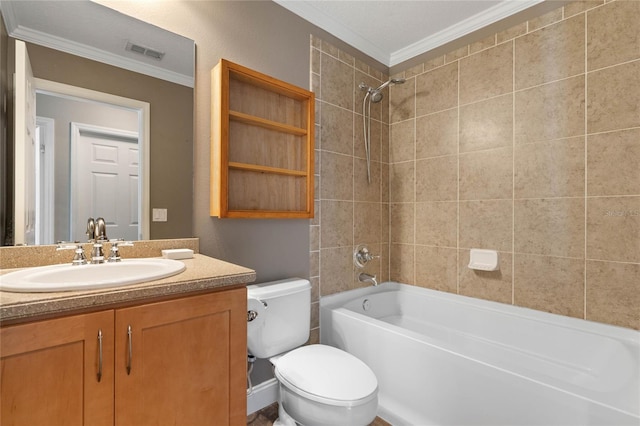 full bathroom with crown molding, vanity, tiled shower / bath combo, and toilet