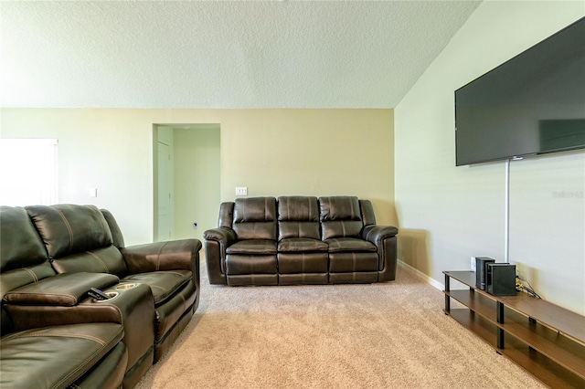 living room featuring light colored carpet, a textured ceiling, and vaulted ceiling