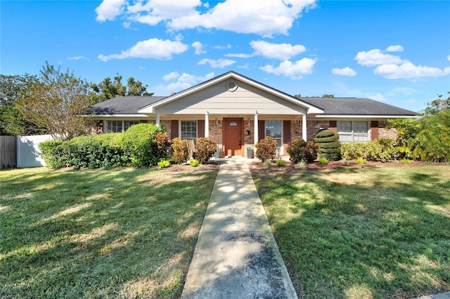 single story home featuring a front yard