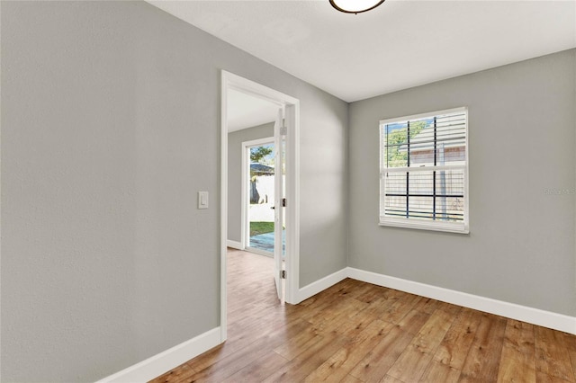 spare room featuring light hardwood / wood-style flooring