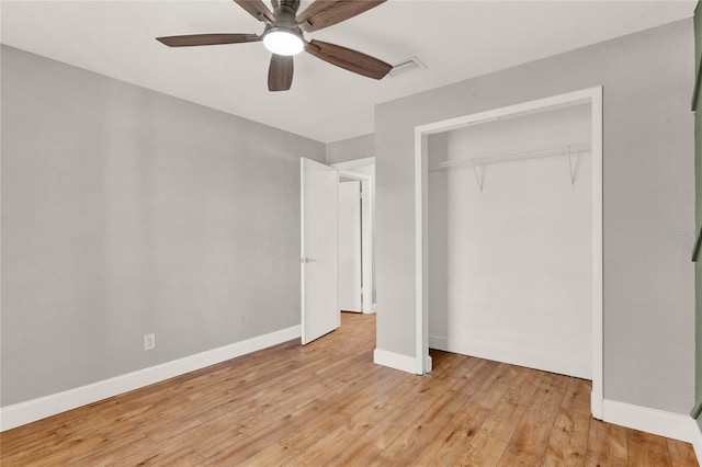 unfurnished bedroom with ceiling fan, a closet, and light hardwood / wood-style flooring