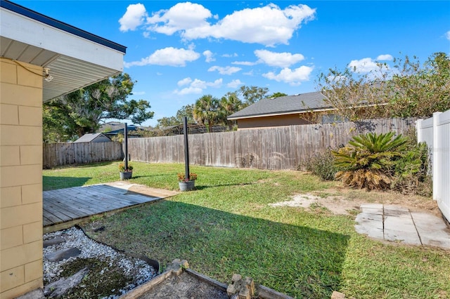 view of yard featuring a wooden deck