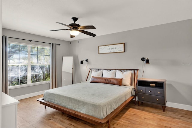 bedroom featuring light hardwood / wood-style floors and ceiling fan