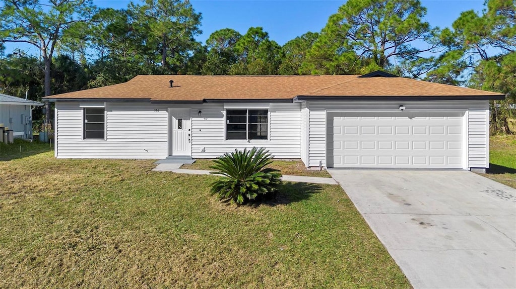 single story home featuring a front lawn and a garage